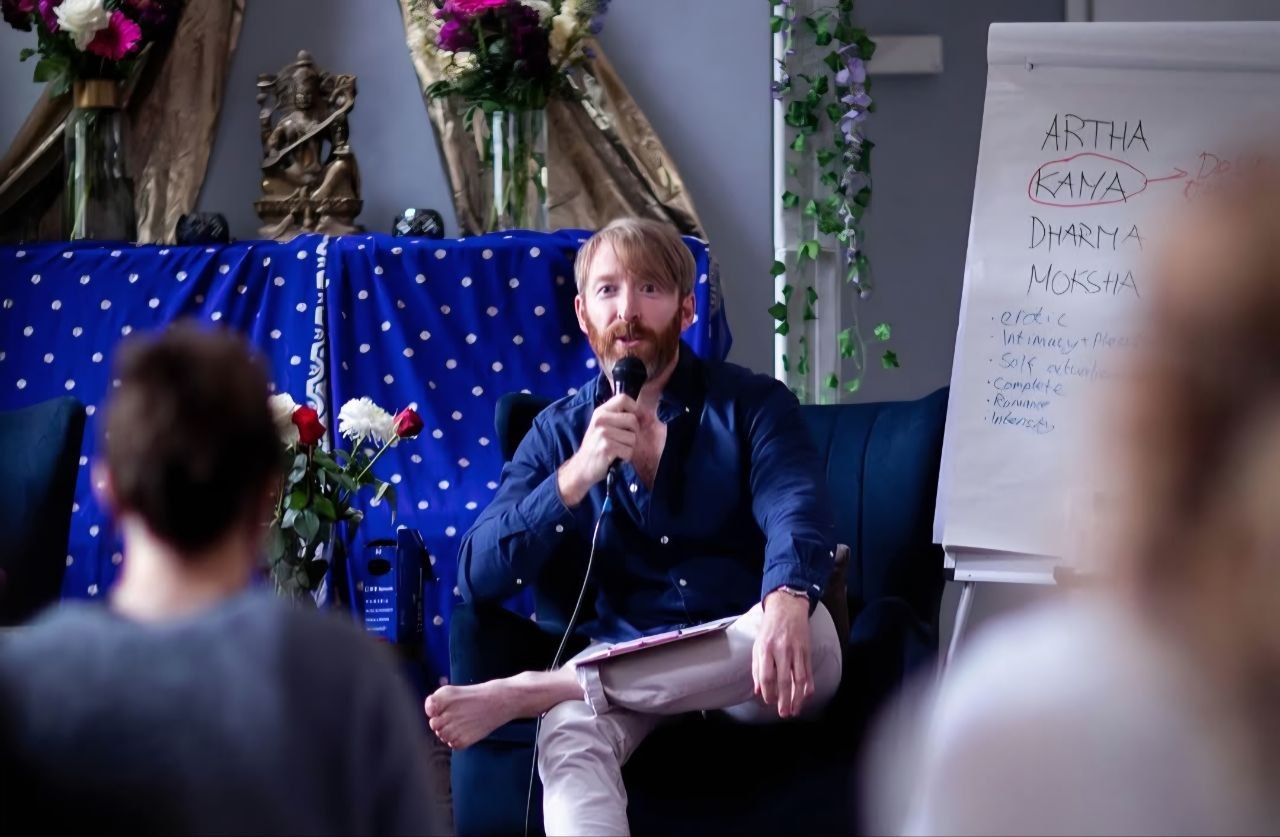Kieran Dowling teaching a men’s group, working through material at a whiteboard