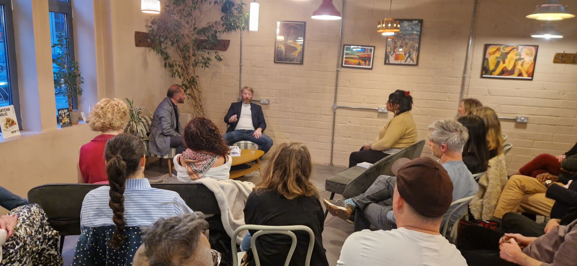 A full room listening to Kieran Dowling in conversation at a Rose & Sword book event